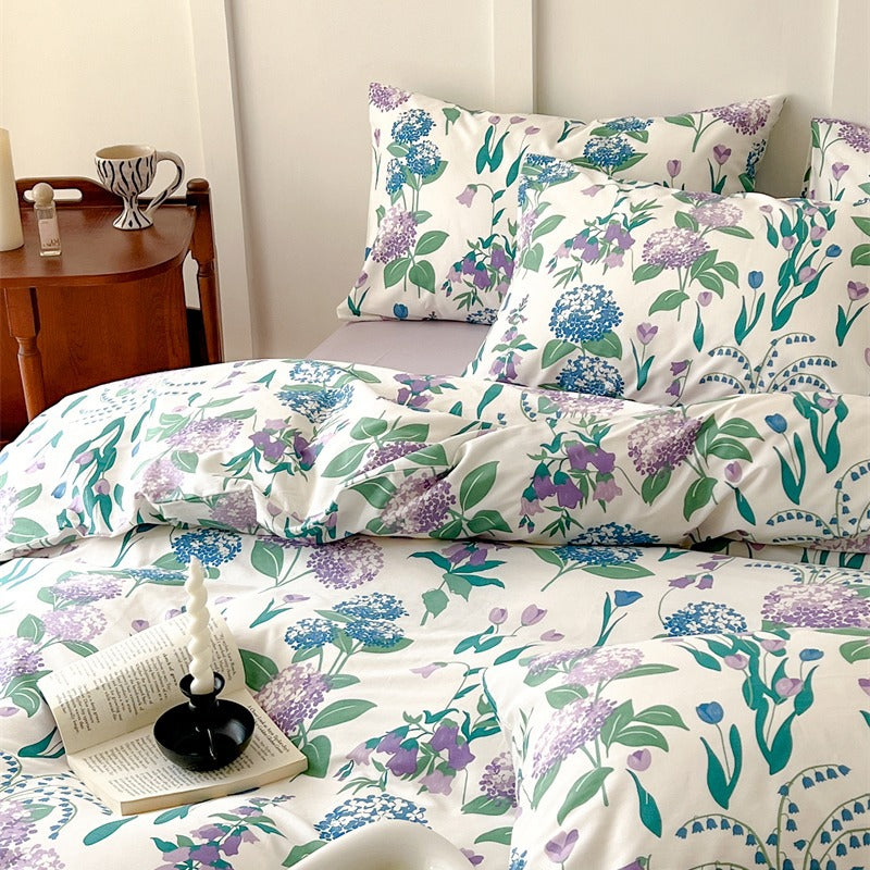 Another angle of ivory blue and purple botanical cotton bedding - Roomden