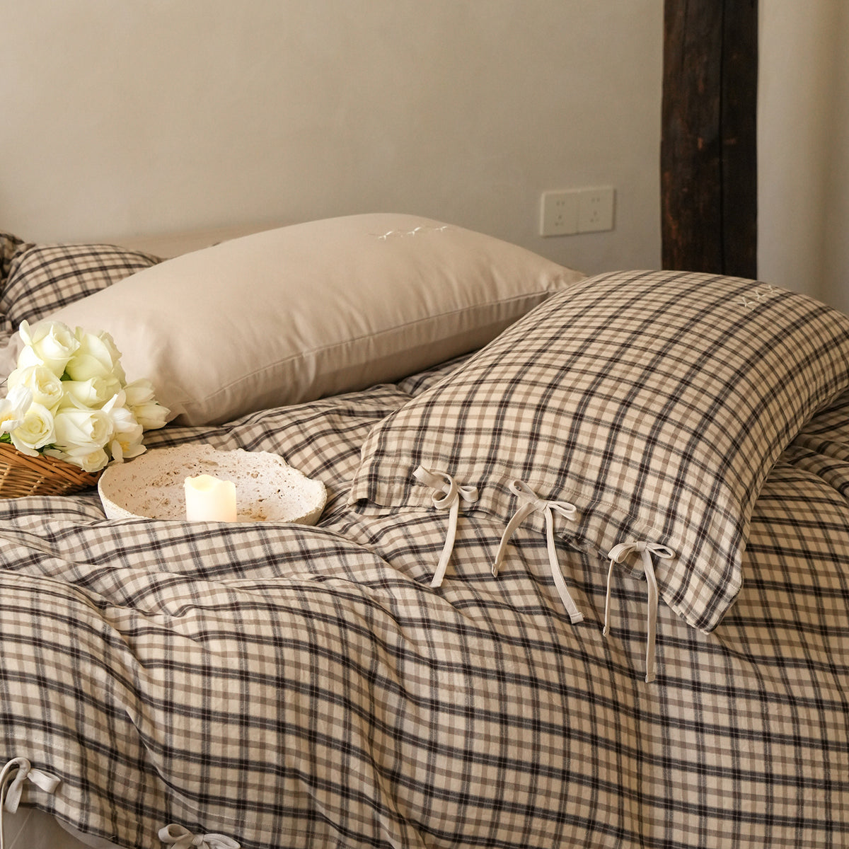 Checked Cotton Bedding Set with Bows and Lace – bow-trimmed tea check duvet folded beneath a plain pillow - Roomden