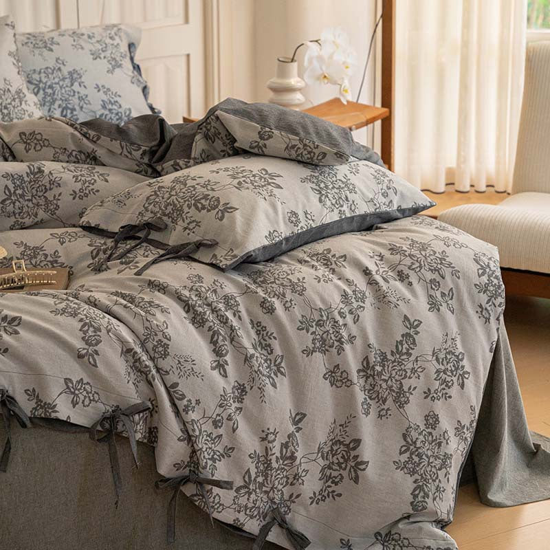 Dark gray Bonnie floral bedding styled in a bright bedroom