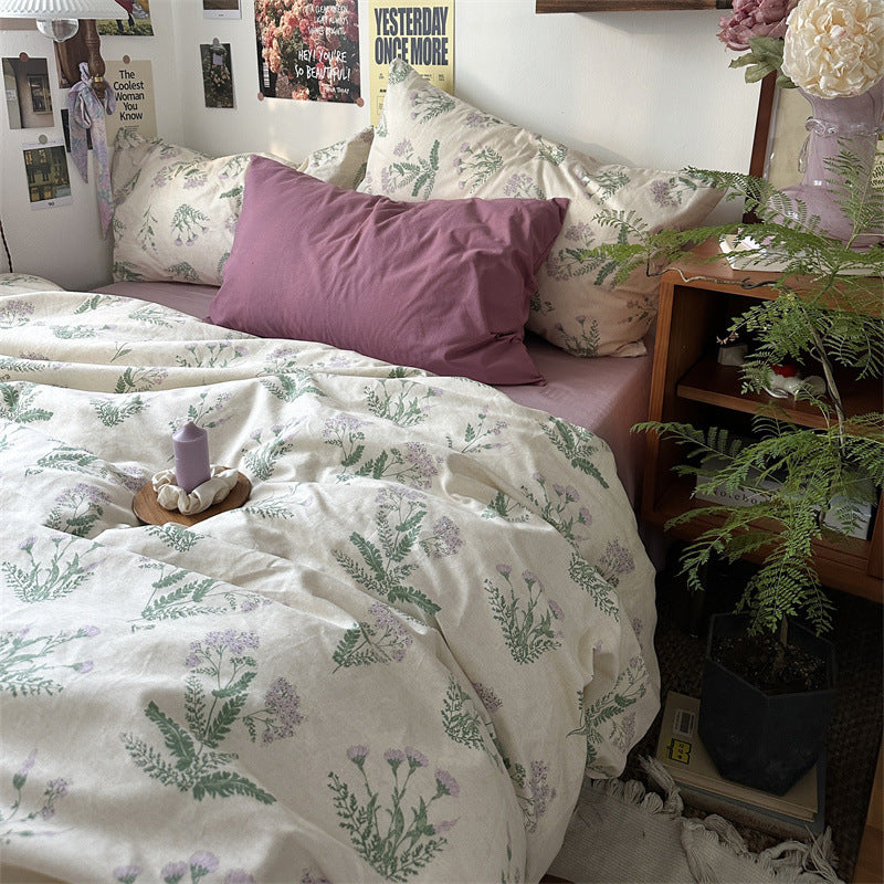 Florhaven Green Botanical cotton bedding set – bedroom view of green botanical duvet and muted plum companion fabric - Roomden