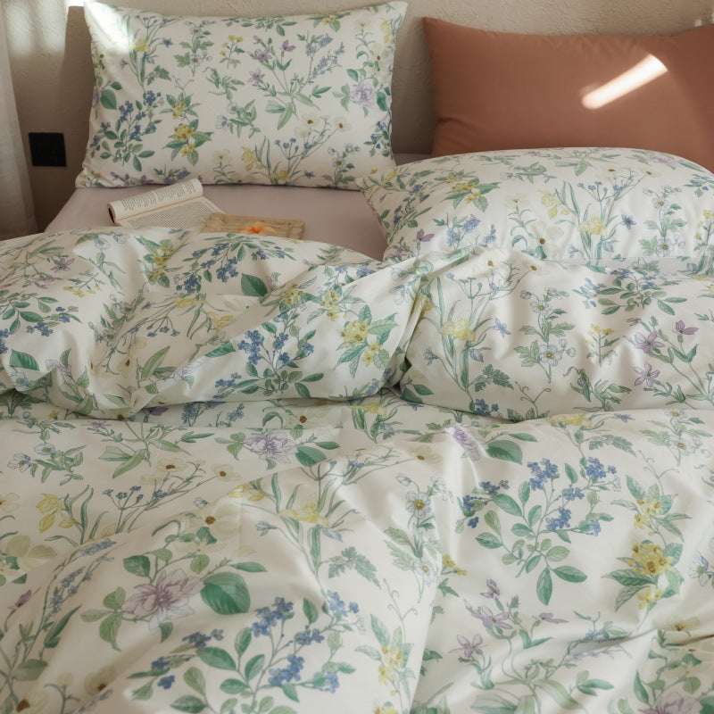 Verbena Botanical Cotton Bedding Set – near view of wildflower pillows and the folded duvet edge - Roomden