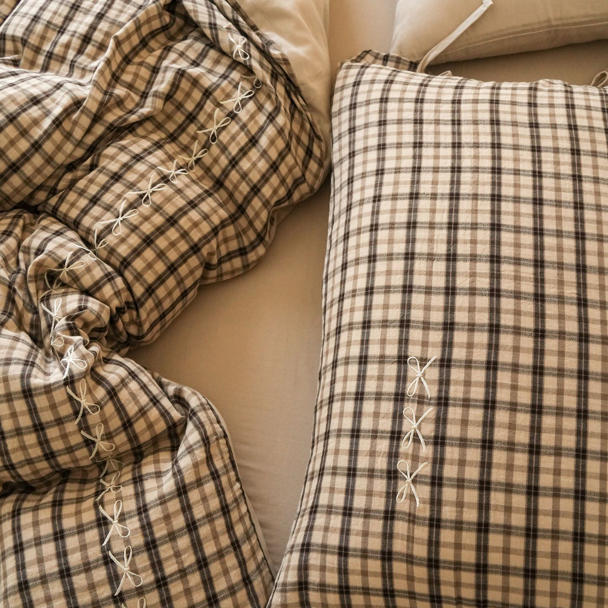 Checked Cotton Bedding Set with Bows and Lace – close view of tea check pillows and crinkled cotton fabric - Roomden