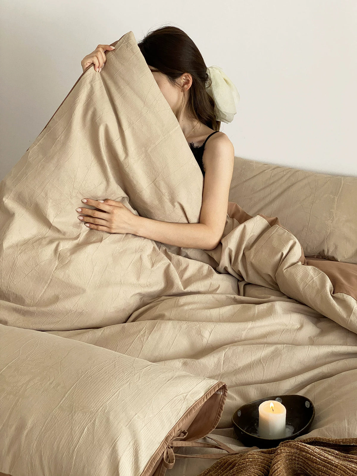 Odile Brushed Cotton Bedding Set – beige pillowcase held upright - Roomden