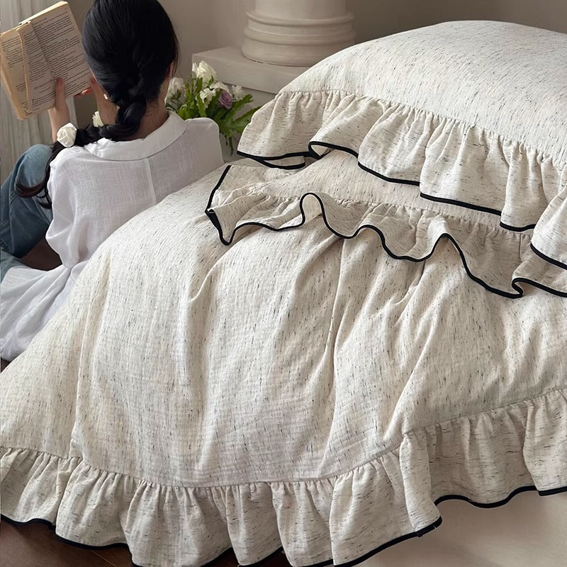 Marchbrook ruffled cotton double-gauze bedding set – close lifestyle view of gathered edging - Roomden
