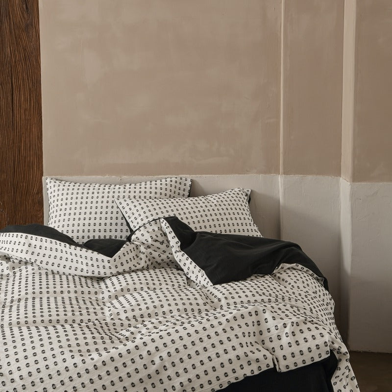 Amberlyn White Dotted cotton bedding set – bedroom view of the patterned duvet and pillows - Roomden