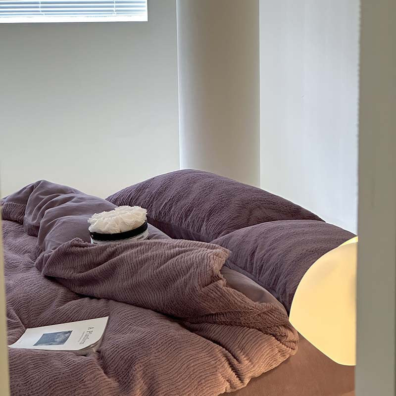 Wave textured plush bedding – dusty lavender pillows and duvet beside the window - Roomden