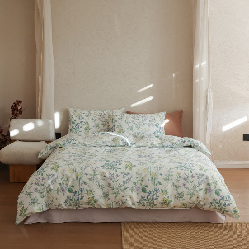 Verbena Botanical Cotton Bedding Set – front view of the wildflower duvet hanging over the bed - Roomden