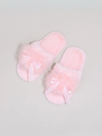 Top down view of Baby Pink fuzzy slippers highlighting the satin bow knot