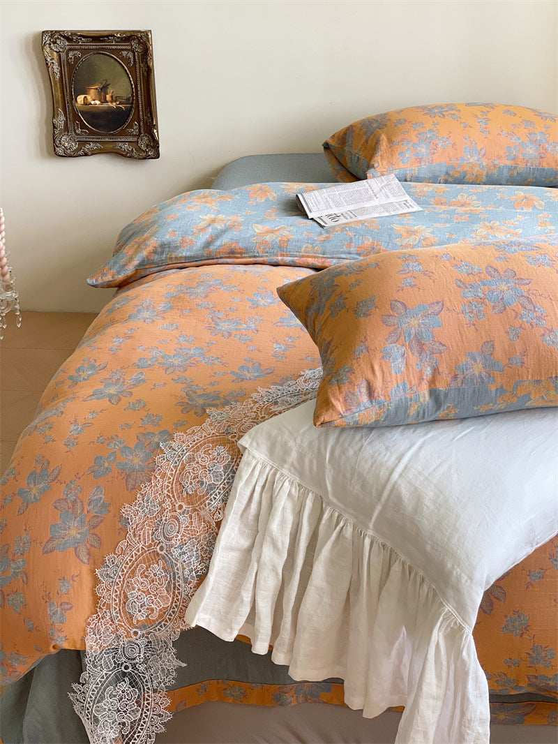 Ornella Apricot Floral Scroll bedding set – apricot floral scroll, angled view of the duvet and coordinating pillows, view 3 - Roomden