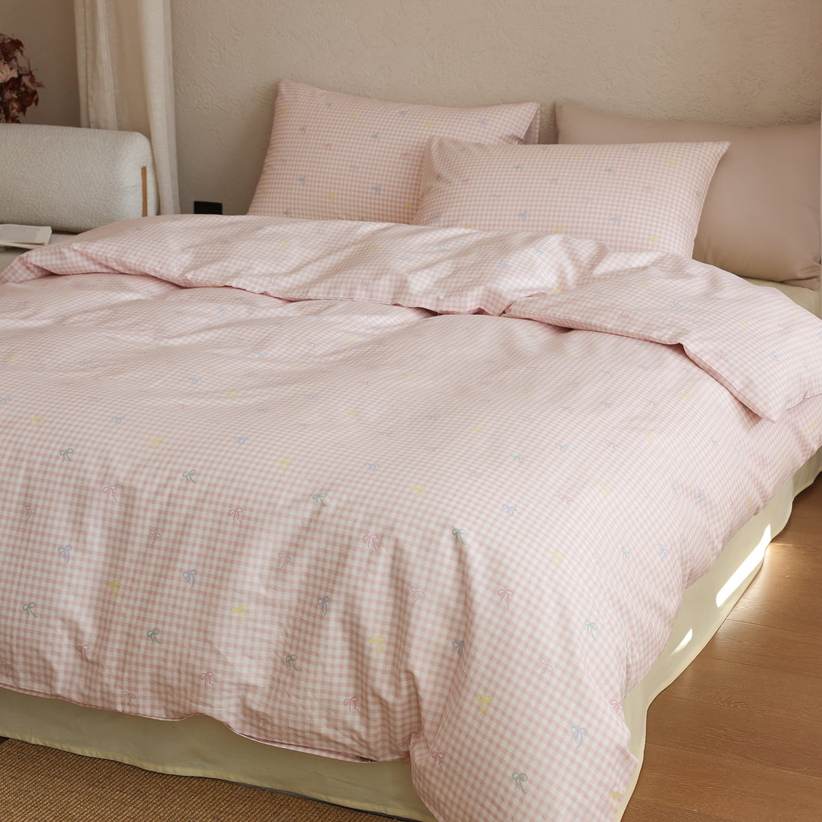 Blush Gingham Bow Cotton Bedding Set – matching pillows and duvet in a softly lit bedroom - Roomden