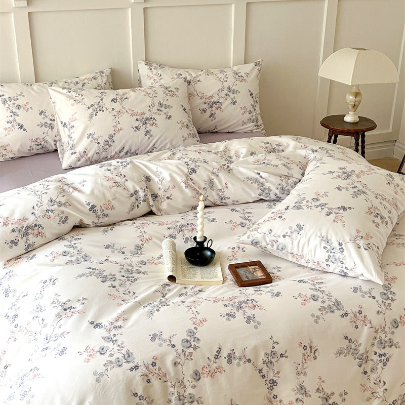 Ivory Blush Botanical Cotton Bedding Set – gray-blue and blush floral sprigs across the ivory duvet and matching pillows - Roomden