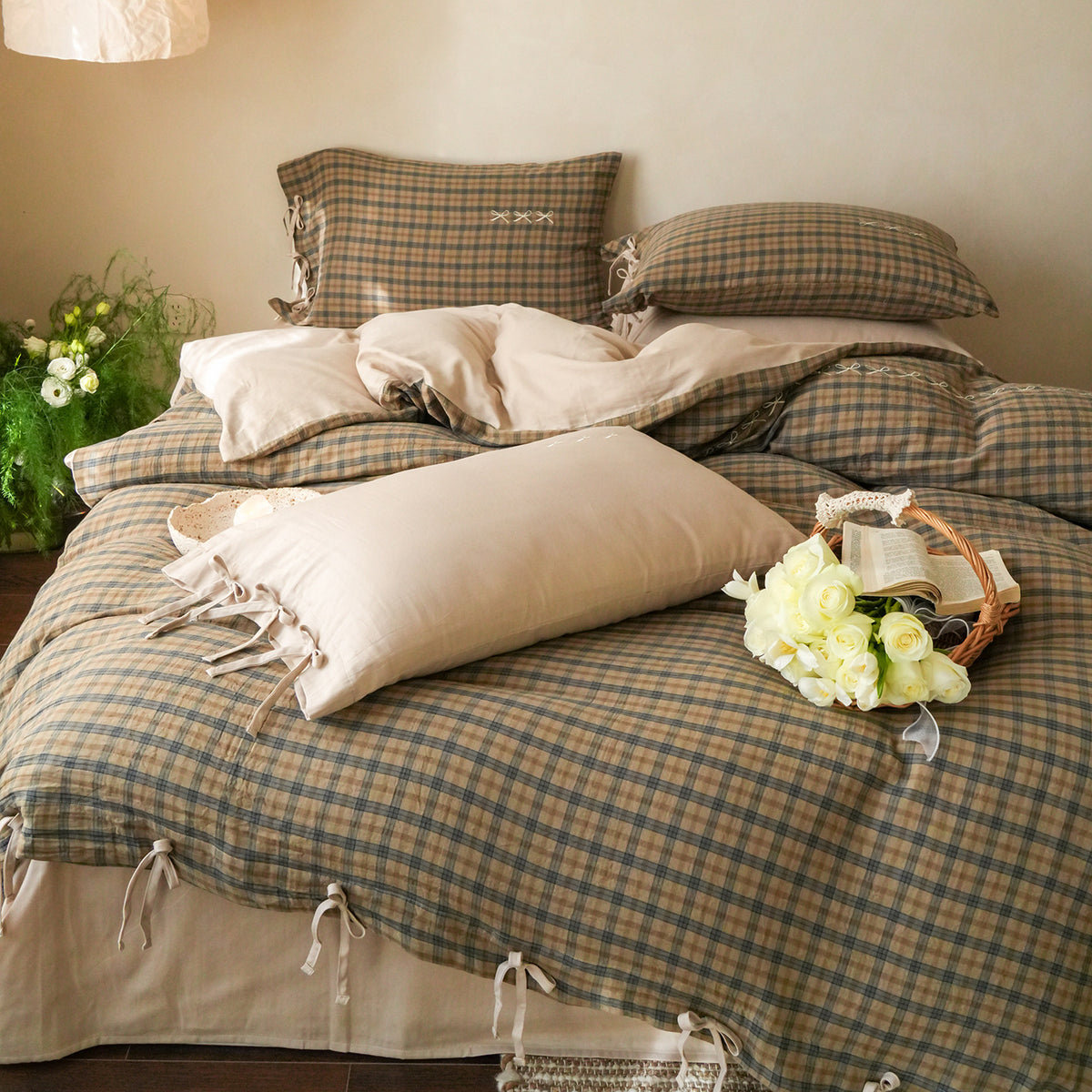 Brackenwood Checked Cotton Bedding Set – full sage check bed with bow trim and a basket of flowers - Roomden