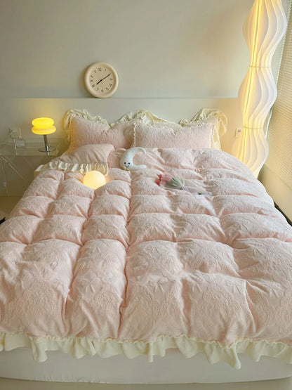 Full bed view of the Pastel Pink Embossed Bow Bedding Set, showcasing its soft and inviting look - RoomDen.