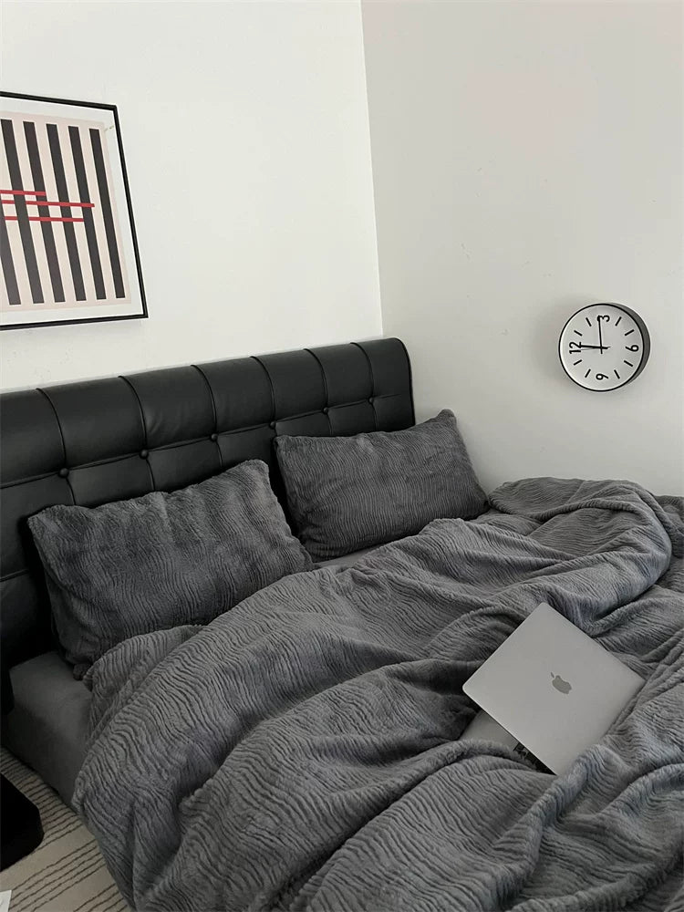 Wave textured plush bedding – charcoal grey bed with a dark upholstered headboard - Roomden