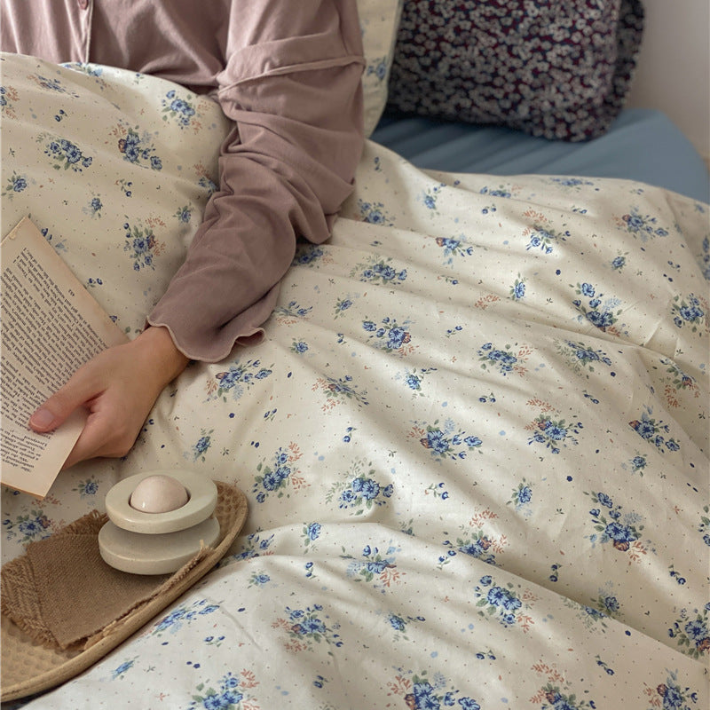 Ivory Blue Floral Cotton Bedding Set – close view of blue flower bouquets and tiny scattered motifs on ivory cotton - Roomden
