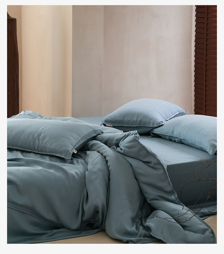 Sandwashed Lyocell Bedding Set – Deep Blue, relaxed bed arrangement showing the fabric drape - Roomden