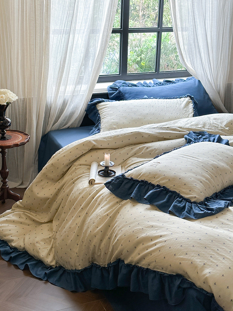 Fleurette Blue Star Sprig Double Gauze Bedding Set – Ivory sprig pillows and duvet beside the window - Roomden