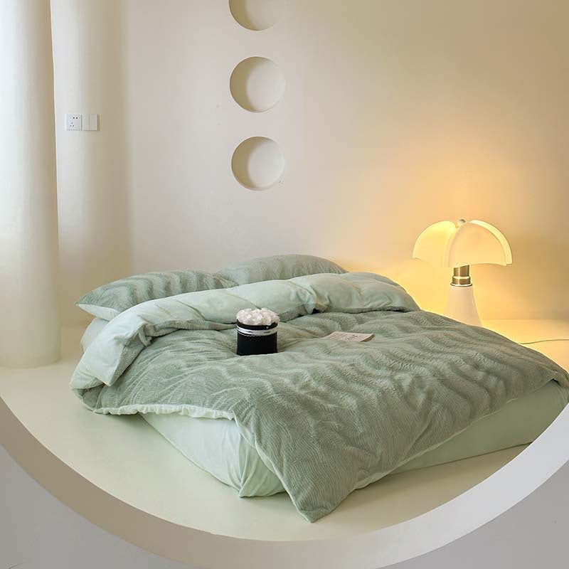 Wave textured plush bedding – sage green full bed on a curved white platform - Roomden