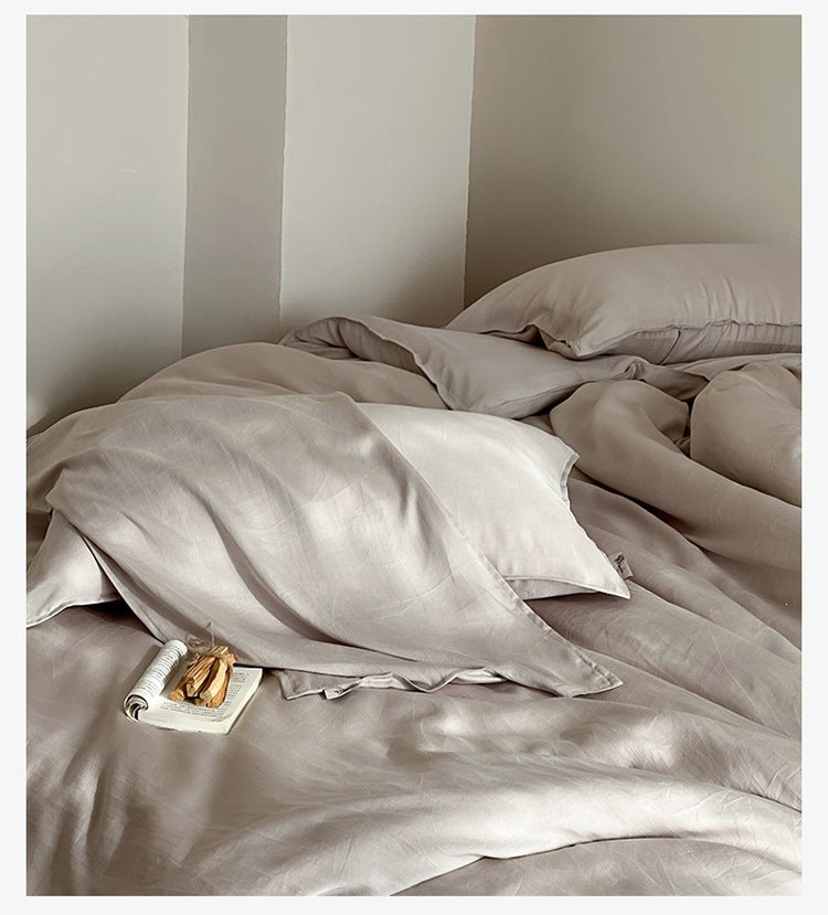 Sandwashed Lyocell Bedding Set – Morning Mist Grey, relaxed bed arrangement showing the fabric drape - Roomden