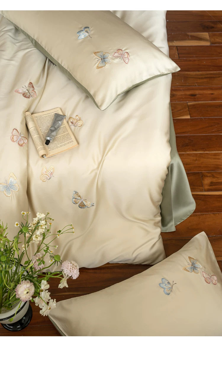 Butterfly embroidered lyocell bedding – Overhead butterfly embroidery detail - Roomden
