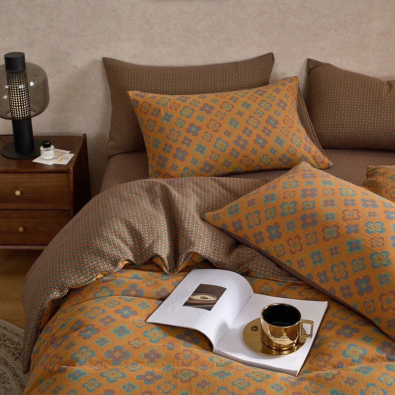 Rosewick Clover Trellis bedding set – mocha yellow, angled view of the duvet and coordinating pillows, view 3 - Roomden