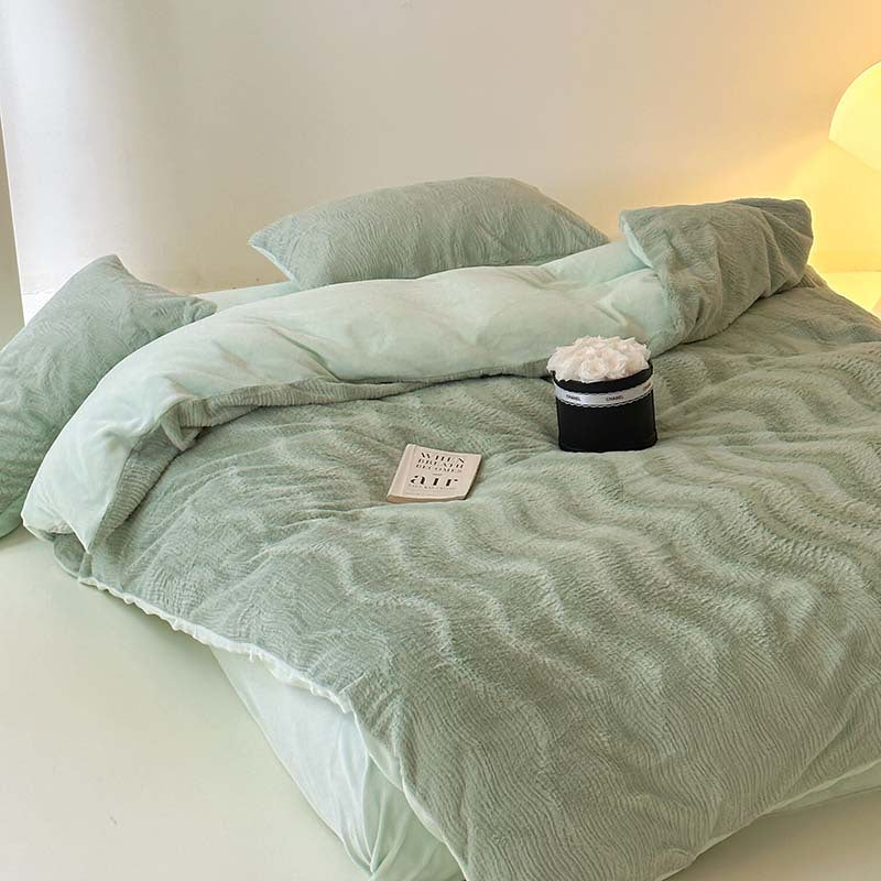 Wave textured plush bedding – sage green angled view of the draped duvet - Roomden