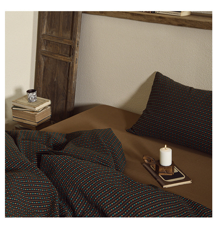 Amberlyn Walnut Micro Check cotton bedding set – bedroom view of the patterned duvet and pillows - Roomden