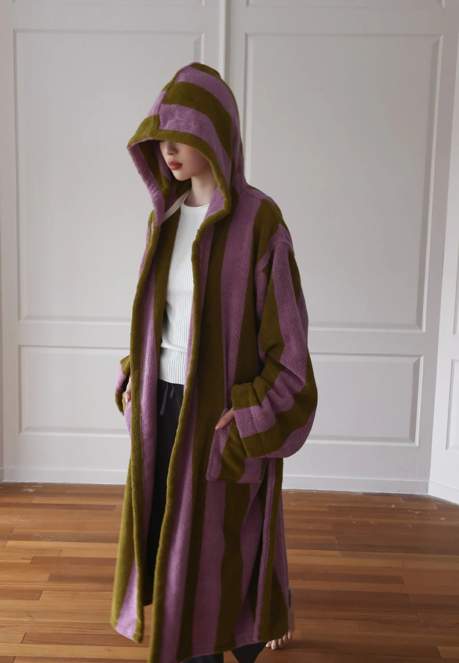 Side profile of the hooded robe showing the relaxed fit and length.