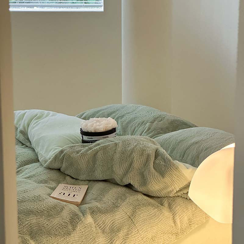 Wave textured plush bedding – sage green bed viewed beside the window - Roomden