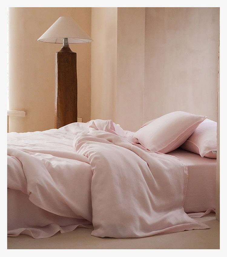 Sandwashed Lyocell Bedding Set – Peach Blush, relaxed bed arrangement showing the fabric drape - Roomden