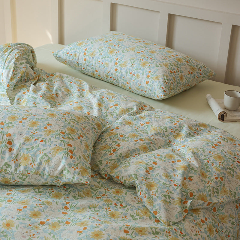 Close angle of pale blue yellow meadow cotton bedding - Roomden
