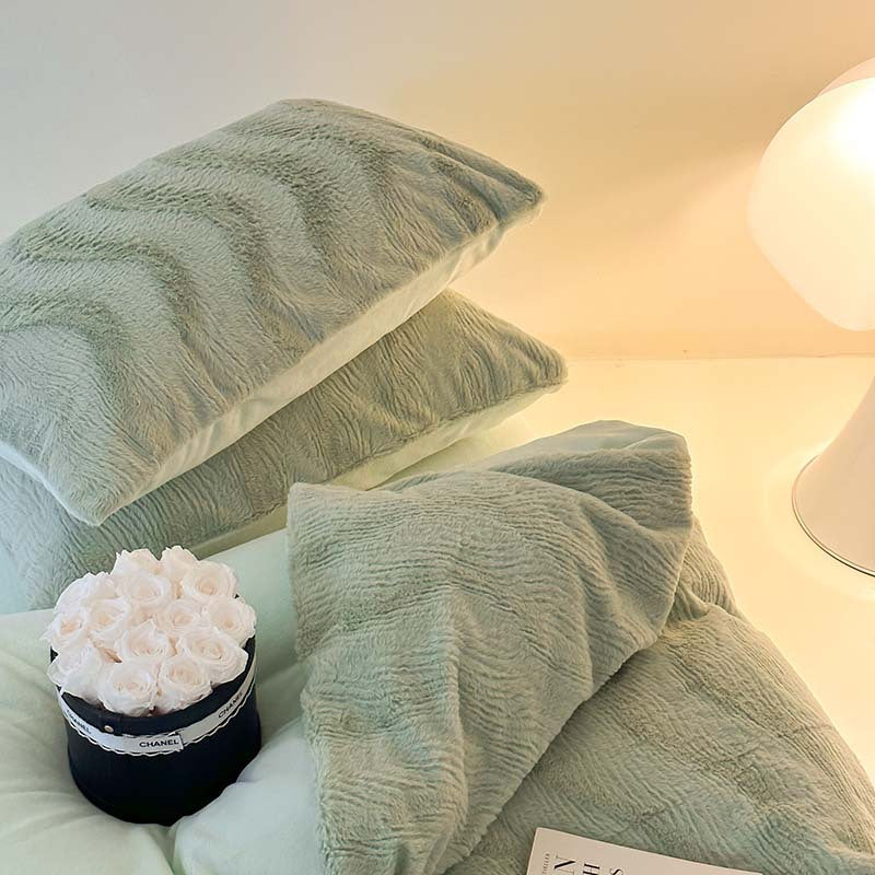 Wave textured plush bedding – sage green stacked pillows showing the wave ridges - Roomden