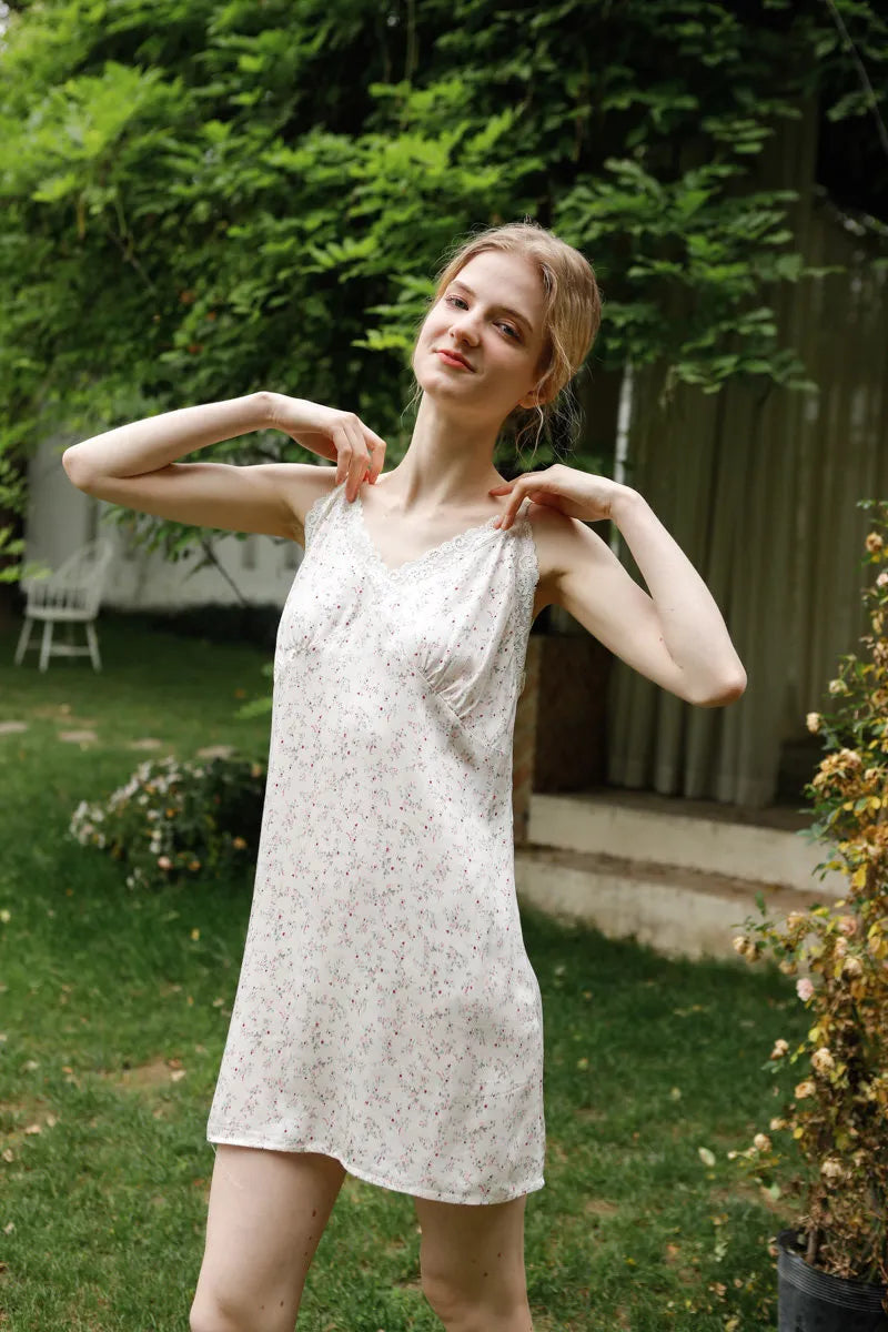 Close up of lace trim neckline on white floral cotton sateen pajama