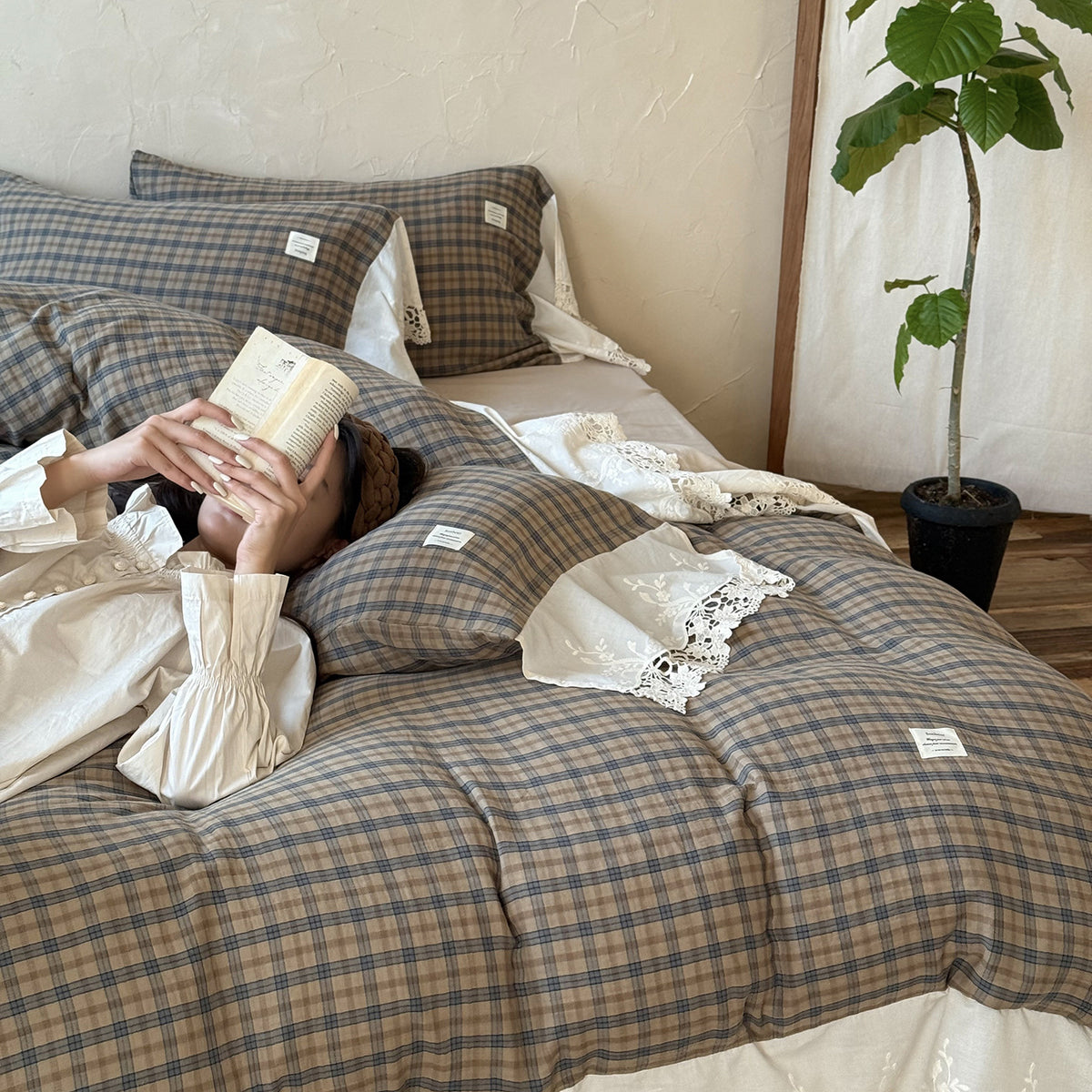 Brackenwood Checked Cotton Bedding Set – sage check pillow and duvet folds beside the white lace trim - Roomden