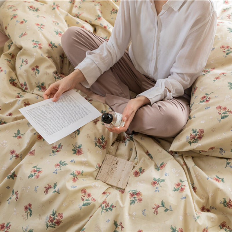 Buttercream Vintage Bouquet Cotton Bedding Set – close bedroom view of the floral duvet folds - Roomden