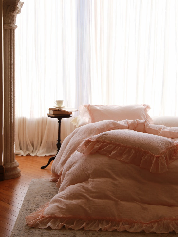 Soft Ruffle Cotton Double Gauze Bedding Set – peach gauze duvet and ruffled pillows in a softly lit room - Roomden
