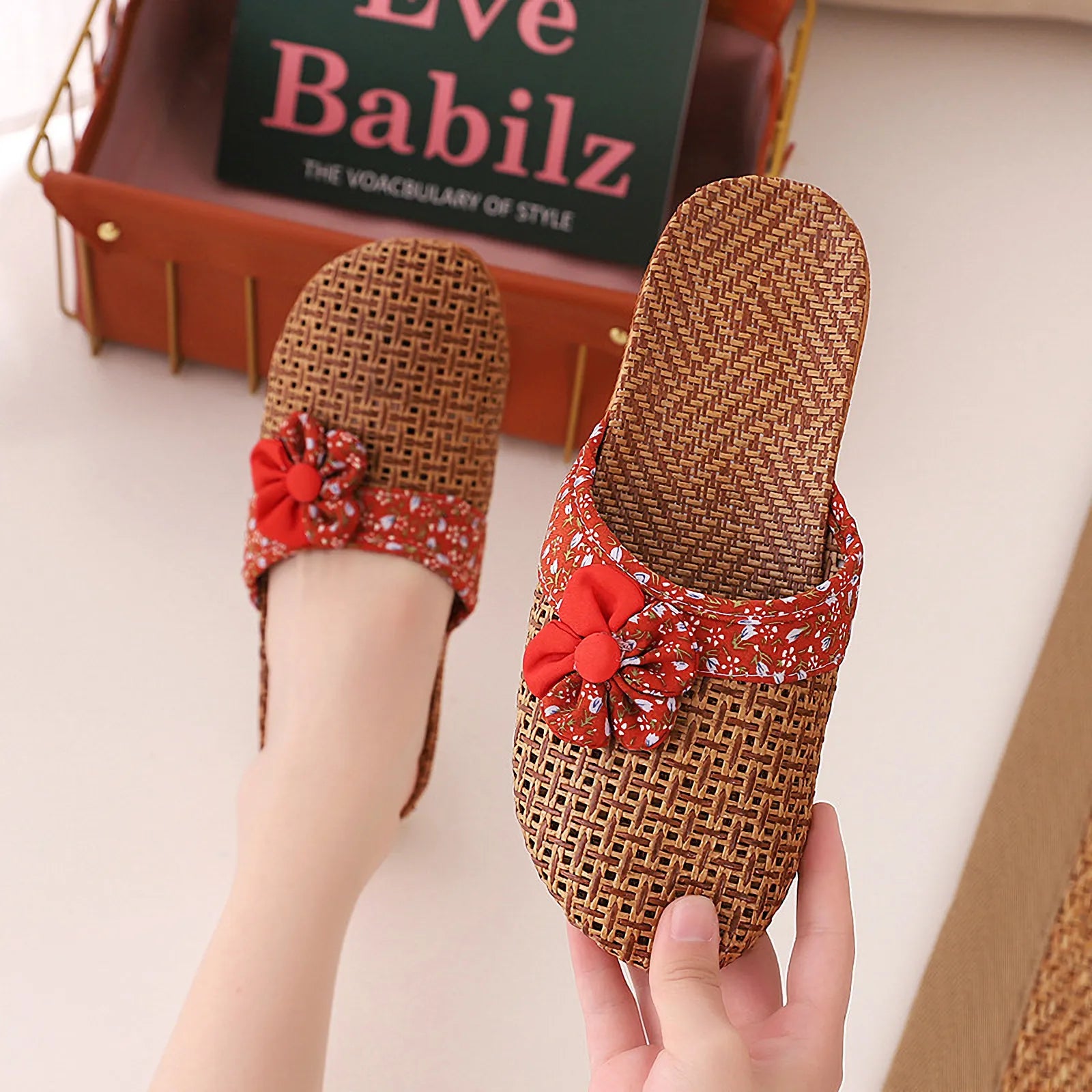 Hand holding Red Floral Natural Rattan House Slipper - RoomDen