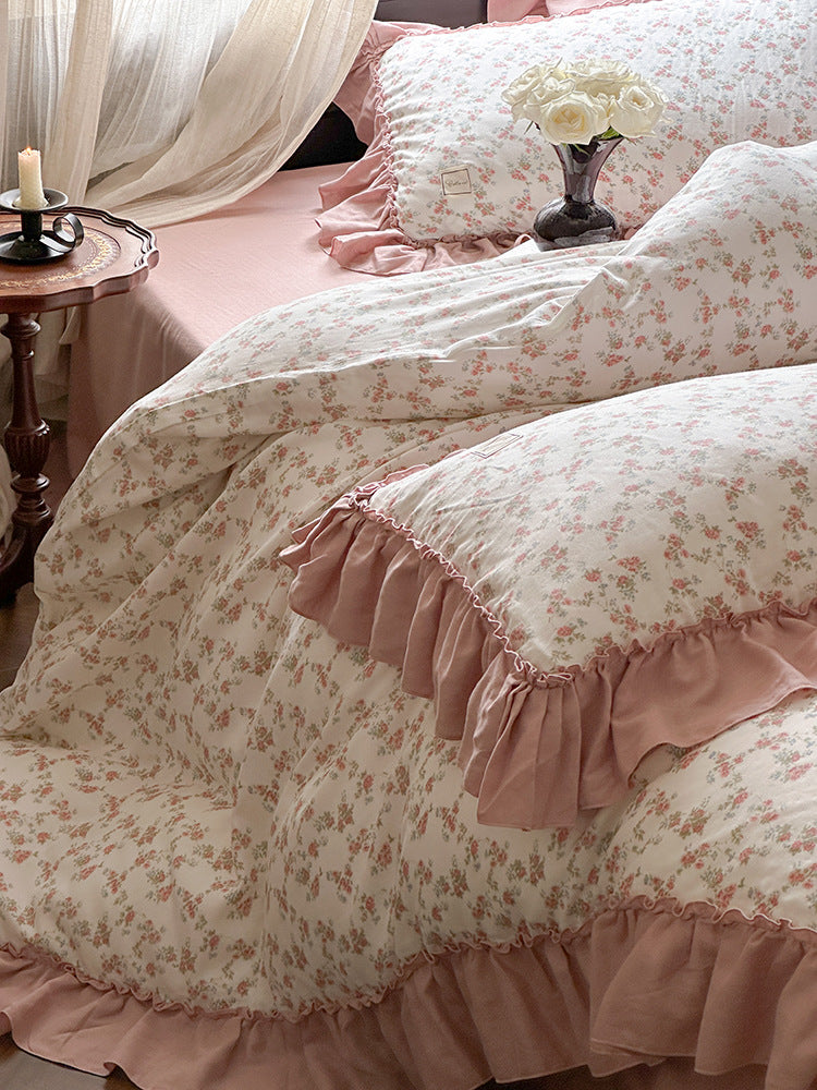 Fleurette Dusty Rose Blossom Double Gauze Bedding Set – Gathered pink border around a floral pillow - Roomden