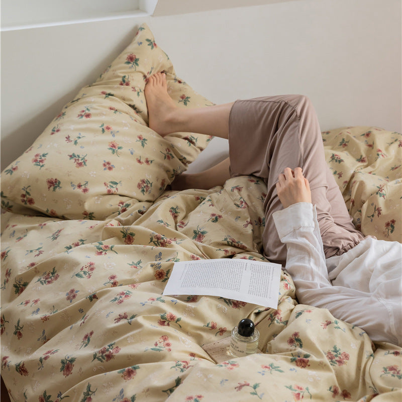 Buttercream Vintage Bouquet Cotton Bedding Set – relaxed bedroom scene showing the draped floral duvet - Roomden