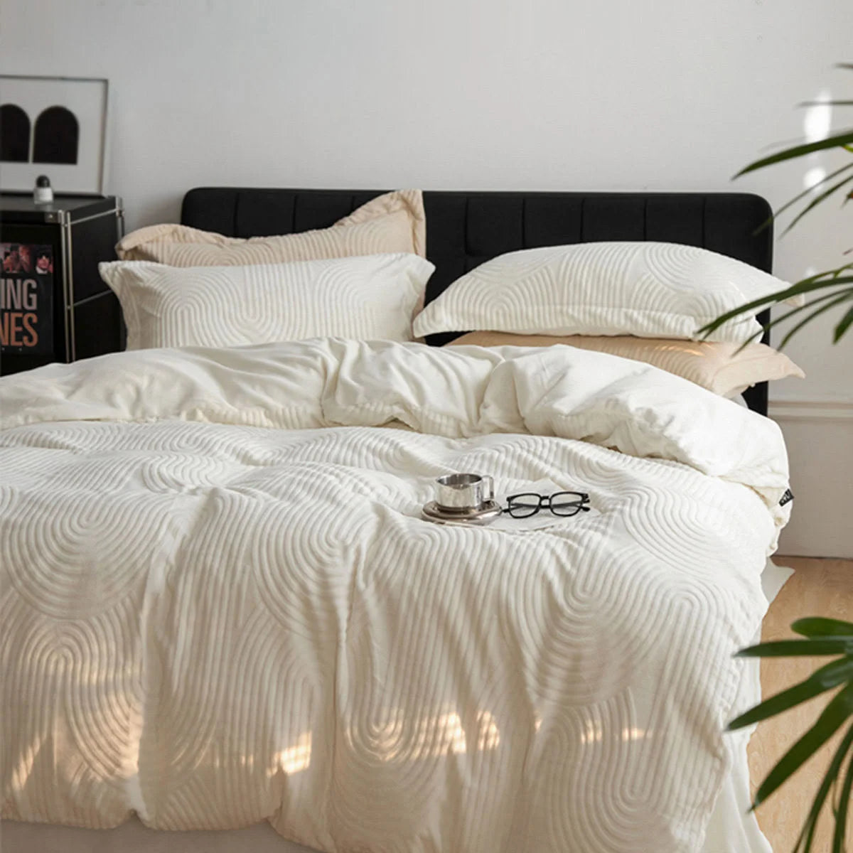 Full view of a bed made with the cream white Plush Wavy Arch Flannel Fleece Bedding Set in a minimalist bedroom. - RoomDen