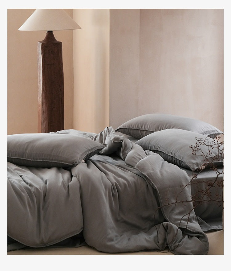 Sandwashed Lyocell Bedding Set – Dusk Grey, relaxed bed arrangement showing the fabric drape - Roomden