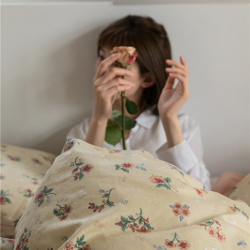 Buttercream Vintage Bouquet Cotton Bedding Set – close view of a bouquet-print pillow in use - Roomden