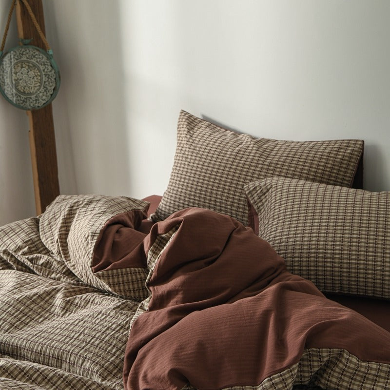 Amberlyn Mauve Mini Check cotton bedding set – angled view of the patterned cotton and plain companion fabric - Roomden