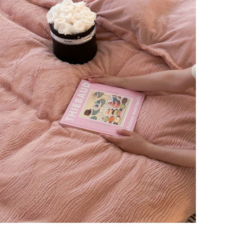 Wave textured plush bedding – blush pink wave texture seen beside a book - Roomden