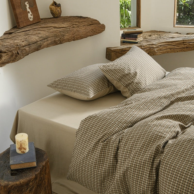 Amberlyn Taupe Mini Check cotton bedding set – bedroom view of the patterned duvet and pillows - Roomden