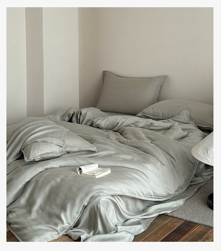 Sandwashed Lyocell Bedding Set – Mist Sage, relaxed bed arrangement showing the fabric drape - Roomden