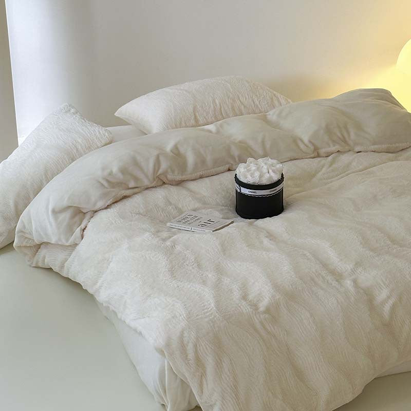 Wave textured plush bedding – creamy white diagonal view of the duvet and pillows - Roomden