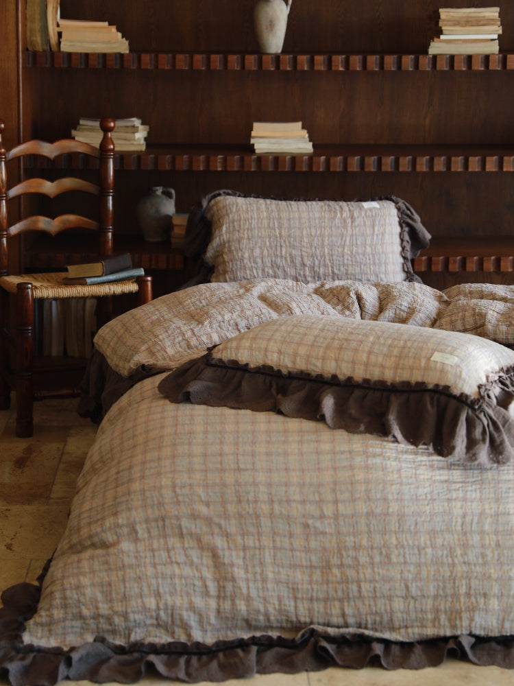Contrast Ruffle Checked Cotton Gauze Bedding Set – oatmeal checked duvet with cocoa ruffles on a wooden bed - Roomden