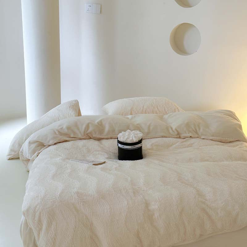 Wave textured plush bedding – creamy white closer front view of the softly draped duvet - Roomden