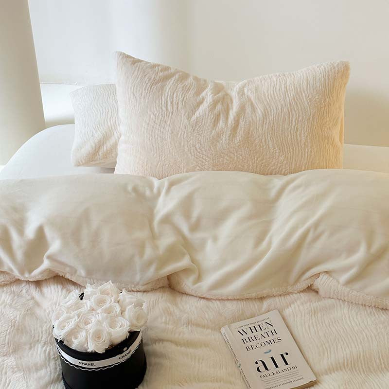 Wave textured plush bedding – creamy white textured pillows above the smooth reverse - Roomden